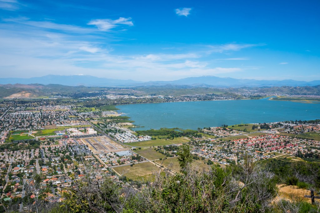 Aerial Panoramic View of Lake Elsinore California with Ortega Mountains and Suburban Development.jpg