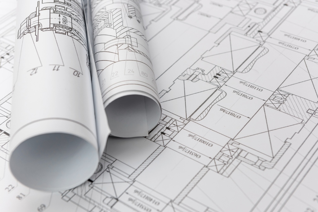 Detailed Architectural Blueprints and Rolled Technical Drawings for Residential Construction.jpg