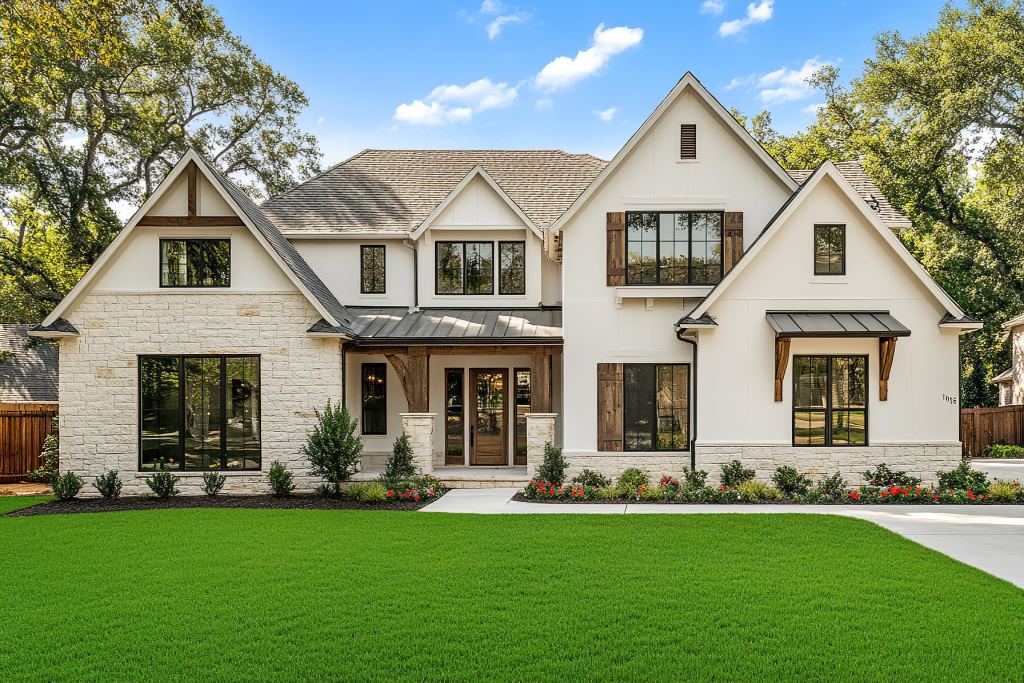 Luxury White Farmhouse with Limestone Facade Wood Shutters and Gable Roof.jpg